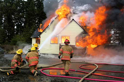 home fire with responding firefighters