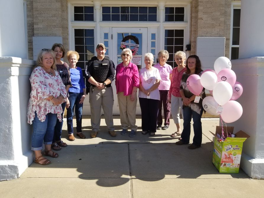 Wirt County CEOS at the breast cancer awareness event with deputy, Dillion Goodnight.