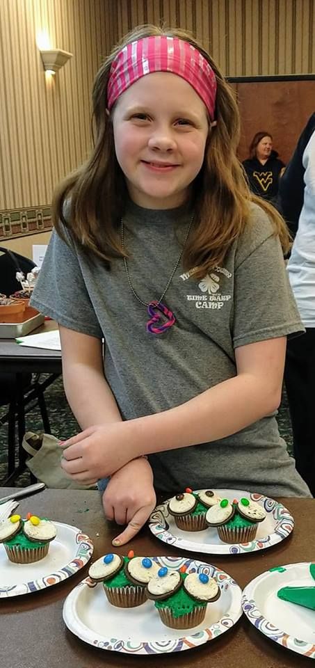 Mineral County 4-H Member showing off her entry into the Cupcake War at the 2019 Multi-County Roundup.