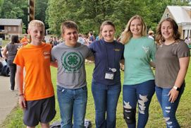 Four 4-H'ers stand together with the Wirt County agent at Older Members Conference at WVU Jackson's Mill.