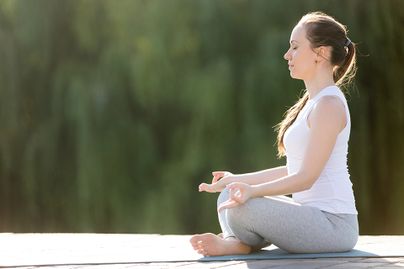 female meditating outdoors