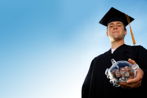 Young graduate holding piggy bank.