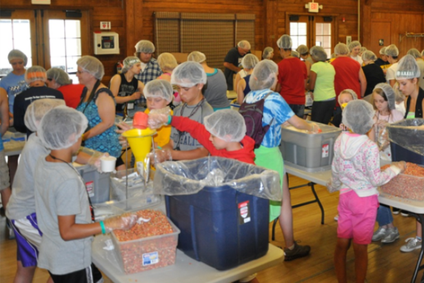 4-H’ers package food for Stop Hunger Now at the Harrison County 4-H all-camp service project. 