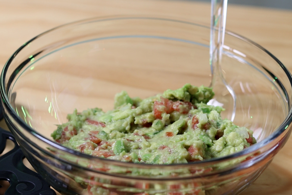 clear bowl of guacamole
