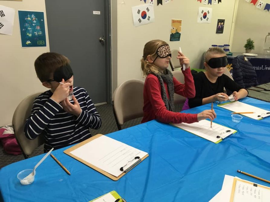 Youth Participate in Blind Taste Test of Different Rice