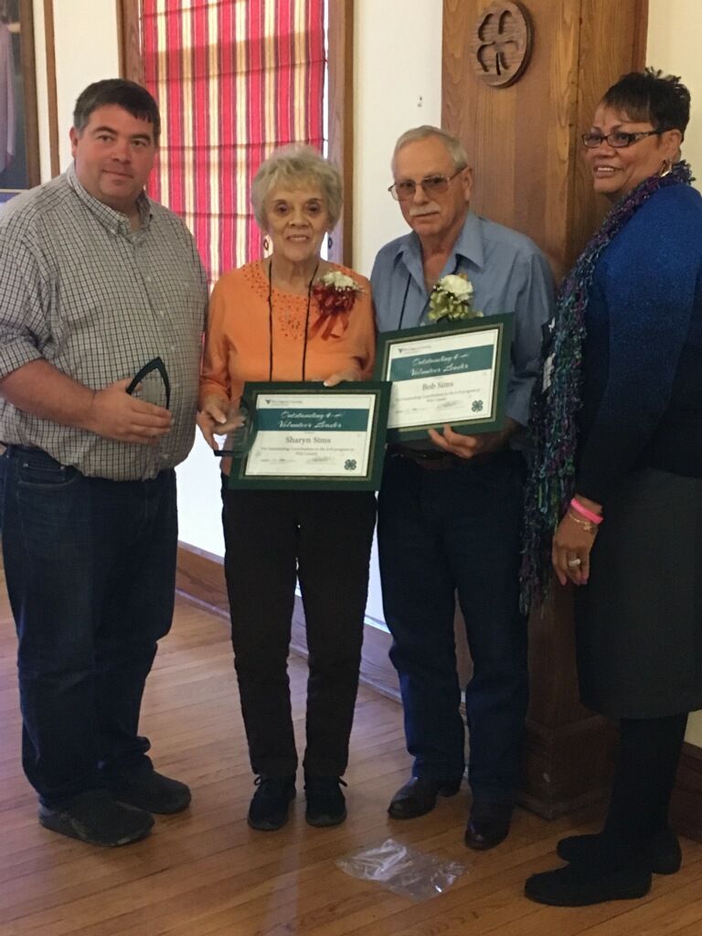 Bob and Sharyn Sims accepted the Outstanding Volunteer Award