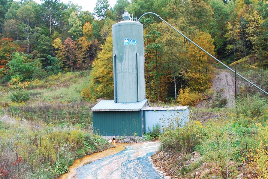 A Department of Environmental Protection tank is typical of an acid mine drainage chemical treatment system.