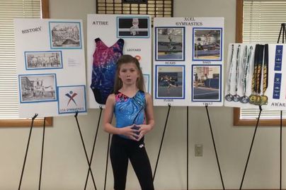 A 4-H youth presents on the topic of gymnastics