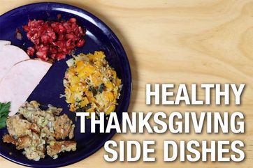 plate with turkey, cranberry salad, whole grain stuffing and butternut squash casserole.