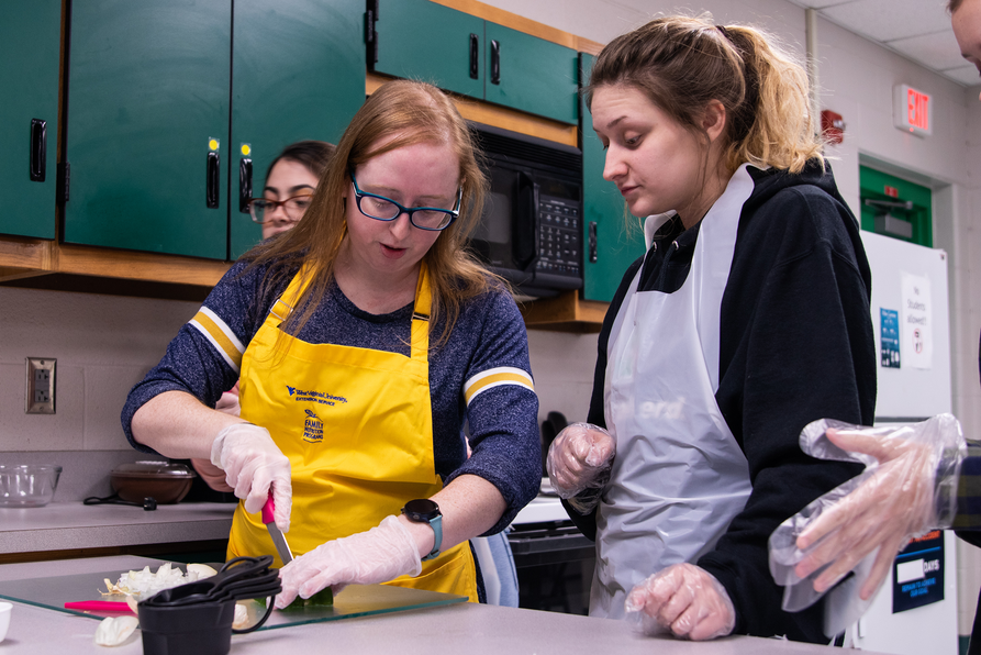 Brandi Adkins, health educator with the WVU Extension Service Family Nutrition Program, teaches a Teen Cuisine class at a high school.