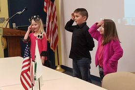 two girls and one boy reciting the 4-H pledge