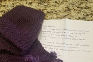 a purple scarf and a note about the scarf