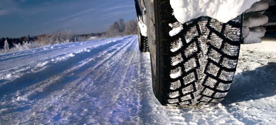 rear wheel of car on a snowy road