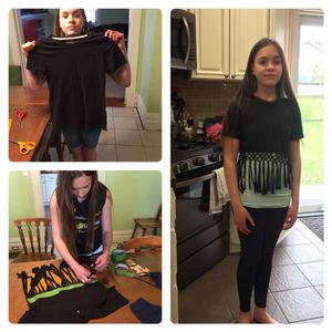 Adelaide Taylor from Roane County demonstrates her 4-H Upcycle entry - a black t-shirt re-imagined with a designed cut-out bottom.