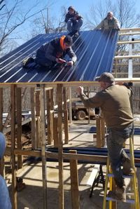 Levi Wright, 2021 Youth in Action award winner, helping to construct the hog barn on Mason County.