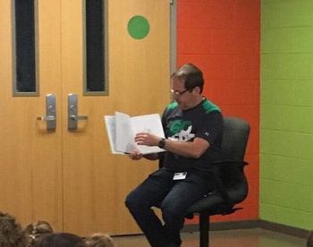 Mr. Conn reads to children at Energy Express