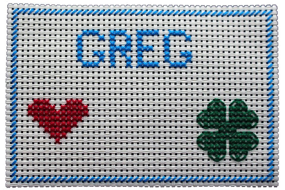 4-H Cross Stitch Nametag that reads Greg.