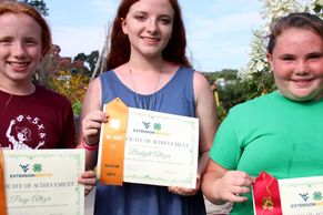 Young girls with their 4-H awards