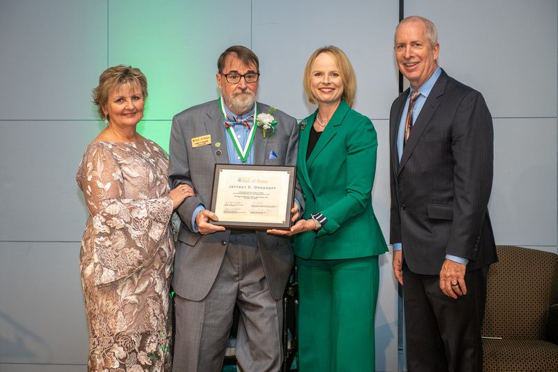 Retired 4-H professional Jeff Orndorff receives his National 4-H Hall of Fame award from National 4-H leaders. 