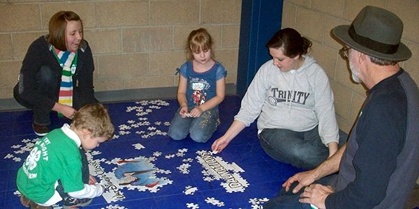 Volunteers and Cloverbuds work puzzles