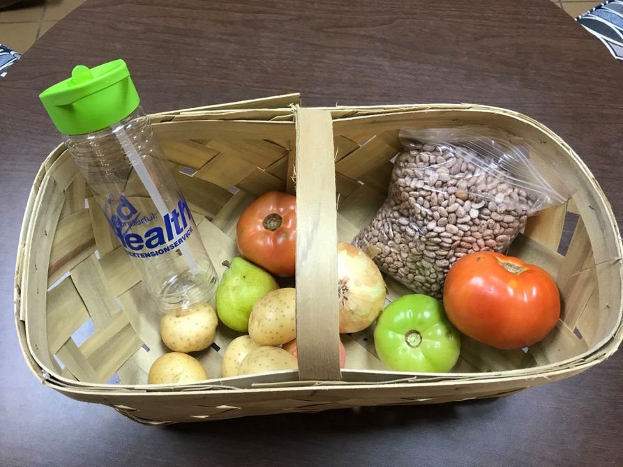 Basket of fresh foods and water bottle for McDowell residents