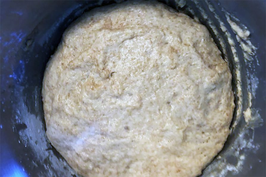 Whole wheat dough for making cinammon rolls in the mixer.