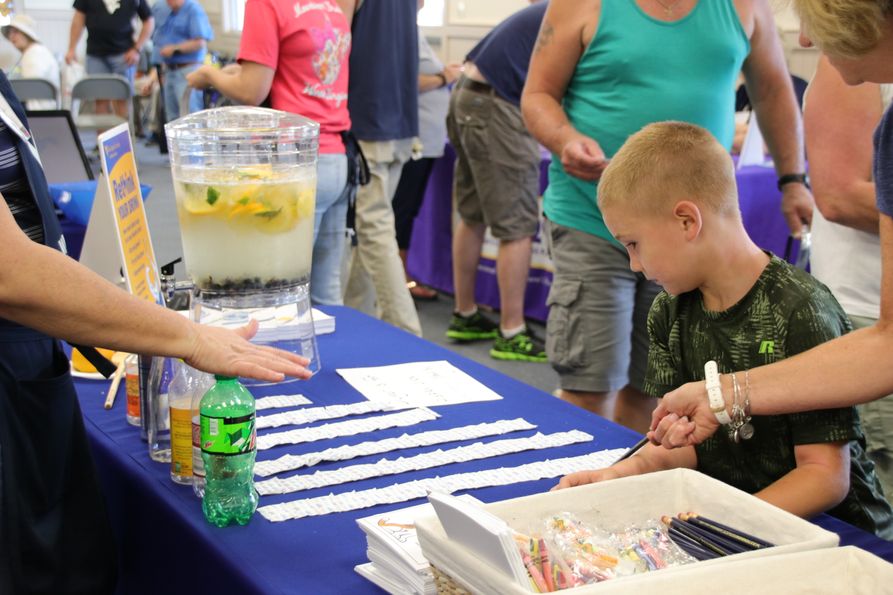 A child looks at a Rethink Your Drink display at the State Fair of West Virginia in 2018.