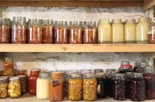 clear jars filled with various foods on a shelf